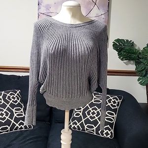 Shiny "fan arm" top by Jennifer Lopez